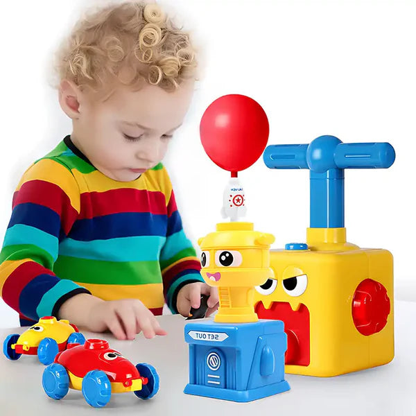 A little boy playing with CutePopToy's Balloon Powered Launcher Toy Set